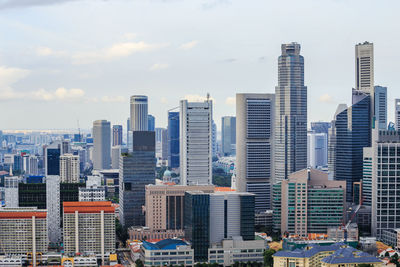 Modern buildings in city against sky