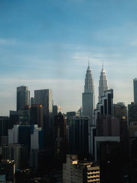 Modern buildings in city against sky