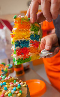 A slice of colorful rainbow cake.