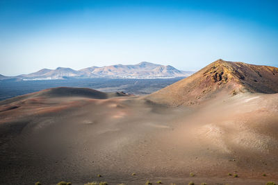 Scenic view of desert against clear sky
