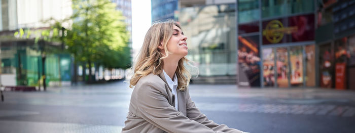 Young woman standing in city