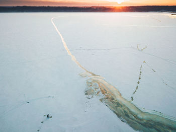 Aerial view of sea against sky during sunset