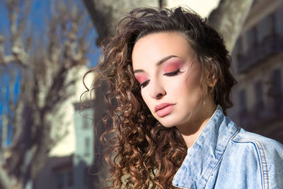Portrait of young woman outdoors