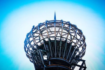 Low angle view of water tower against blue sky