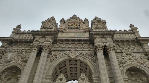 Low angle view of ornate building against sky