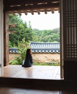 Woman sitting in window