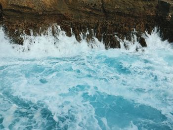 Waves splashing on rocks