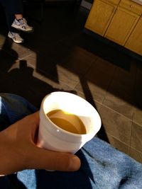 High angle view of woman with tea cup