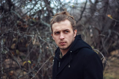 Portrait of young man in autumn