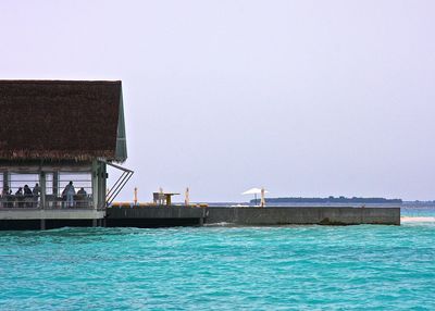 View of sea with buildings in background