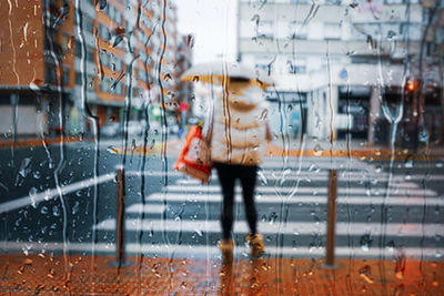 Rear view of woman walking on street