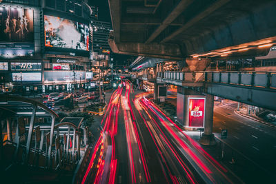 Light trails on road in city at night