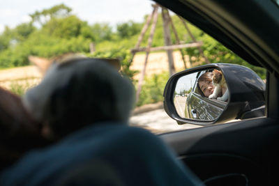 Asian woman drive car for travel roadtrip with her cat