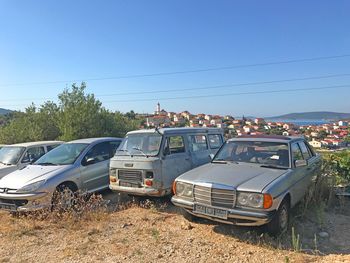 Cars on road against clear sky