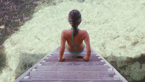 Close-up of woman standing in pond