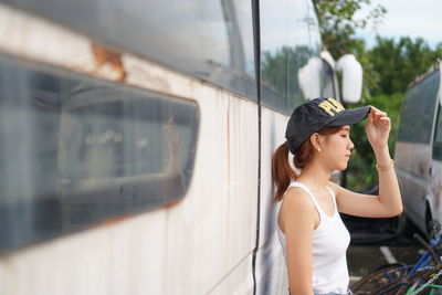 Woman looking through window