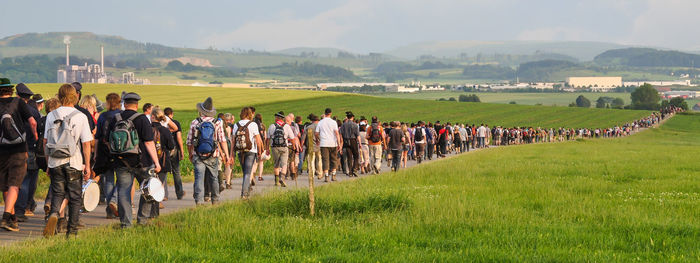 Procession to the schnade in brilon. old and young people are traditionally control the borders.