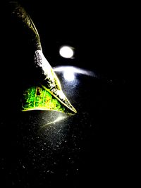 Close-up of illuminated lighting equipment on table