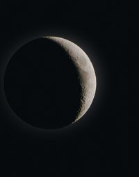 Low angle view of moon against clear sky at night