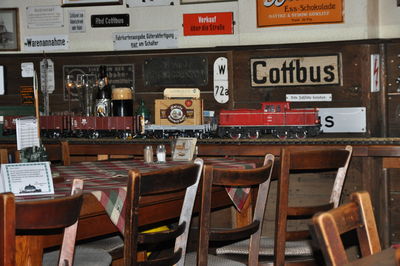 Empty chairs and tables in cafe