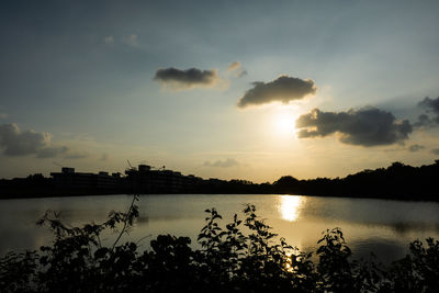 Scenic view of lake against sky during sunset