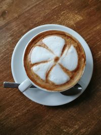 Close-up of cappuccino on table