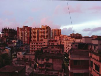 View of residential district against cloudy sky