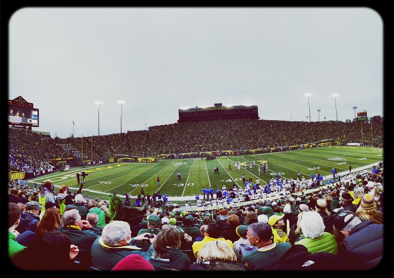 transfer print, auto post production filter, large group of people, building exterior, sky, men, crowd, field, lifestyles, built structure, grass, architecture, leisure activity, landscape, person, outdoors, green color, high angle view, panoramic