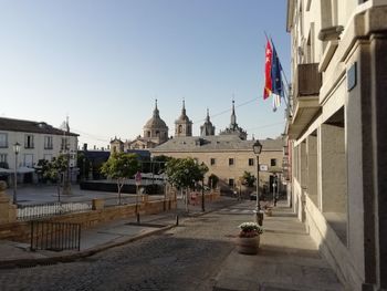 View of buildings in city against clear sky