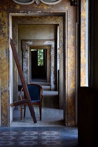 Empty chair in abandoned building