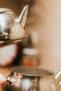 Old , dirty teaput steaming stock photo, old aluminum kettle steaming stock photo