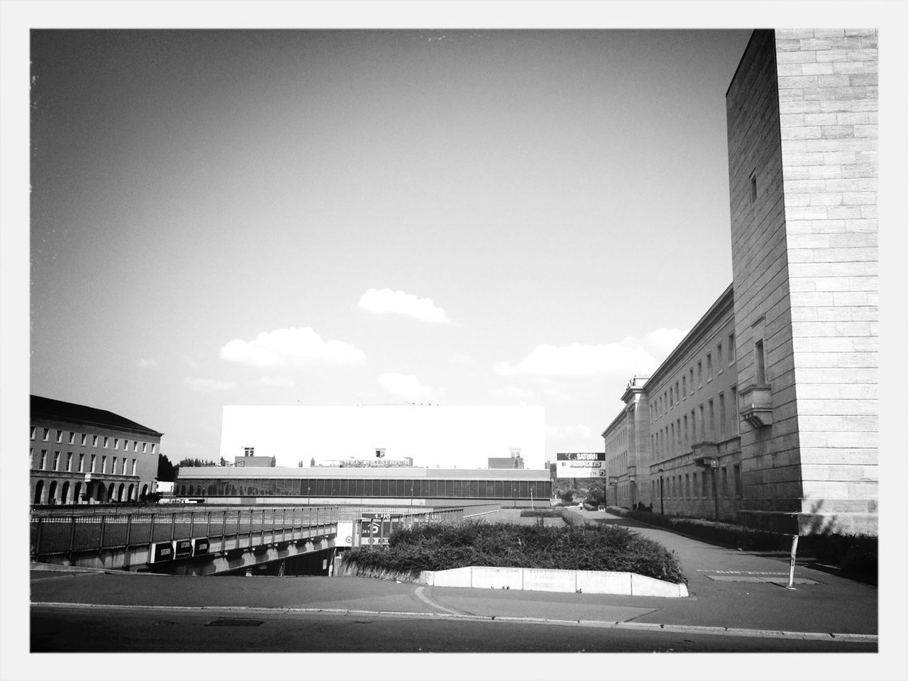 transfer print, architecture, built structure, building exterior, auto post production filter, sky, transportation, sunlight, incidental people, day, outdoors, shadow, city, road, building, no people, cloud, car, person, cloud - sky