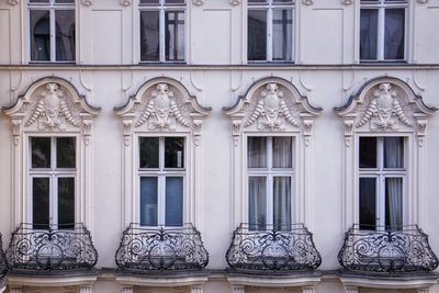 Frontal look on facade with wibdows and ornaments 