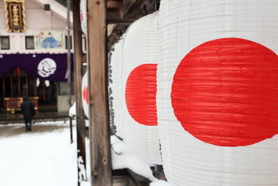 Close-up of red text on snow covered wall