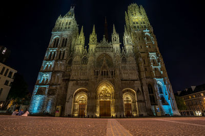 Low angle view of illuminated buildings at night