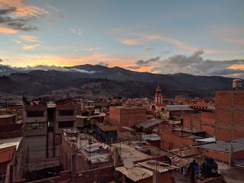 High angle view of town against cloudy sky