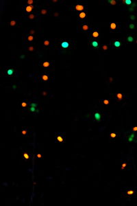 Defocused image of illuminated lights at night