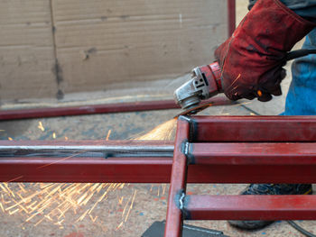 Close-up of worker welding metal