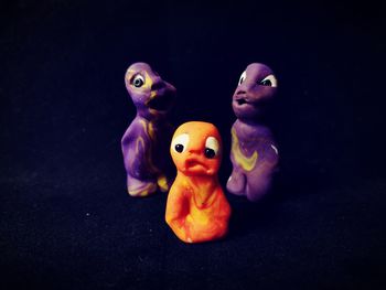 Close-up of stuffed toy against black background
