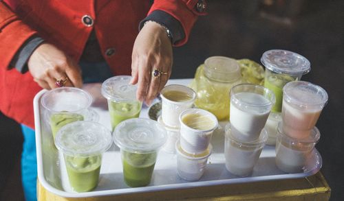 High angle view of hand holding drink