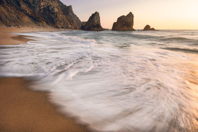 Scenic view of beach against sky