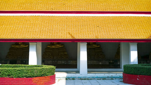 Multi colored roof against building. buddhist temple in bangkok thailand. 