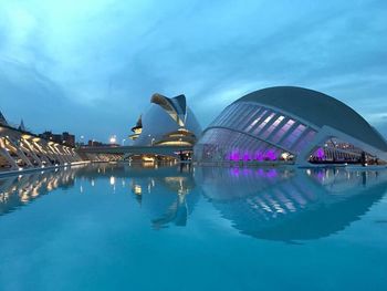 Reflection of building in water at night