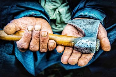 Close-up of man holding hands