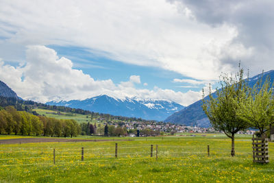 Scenic view of landscape and mountains against sky