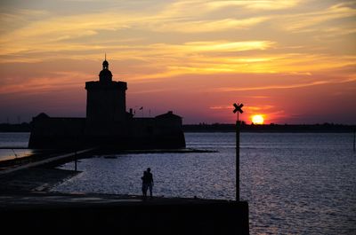 Silhouette of buildings at sunset