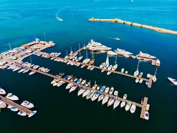 High angle view of sailboats moored in sea