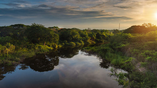 Scenic view of lake against sky during sunset