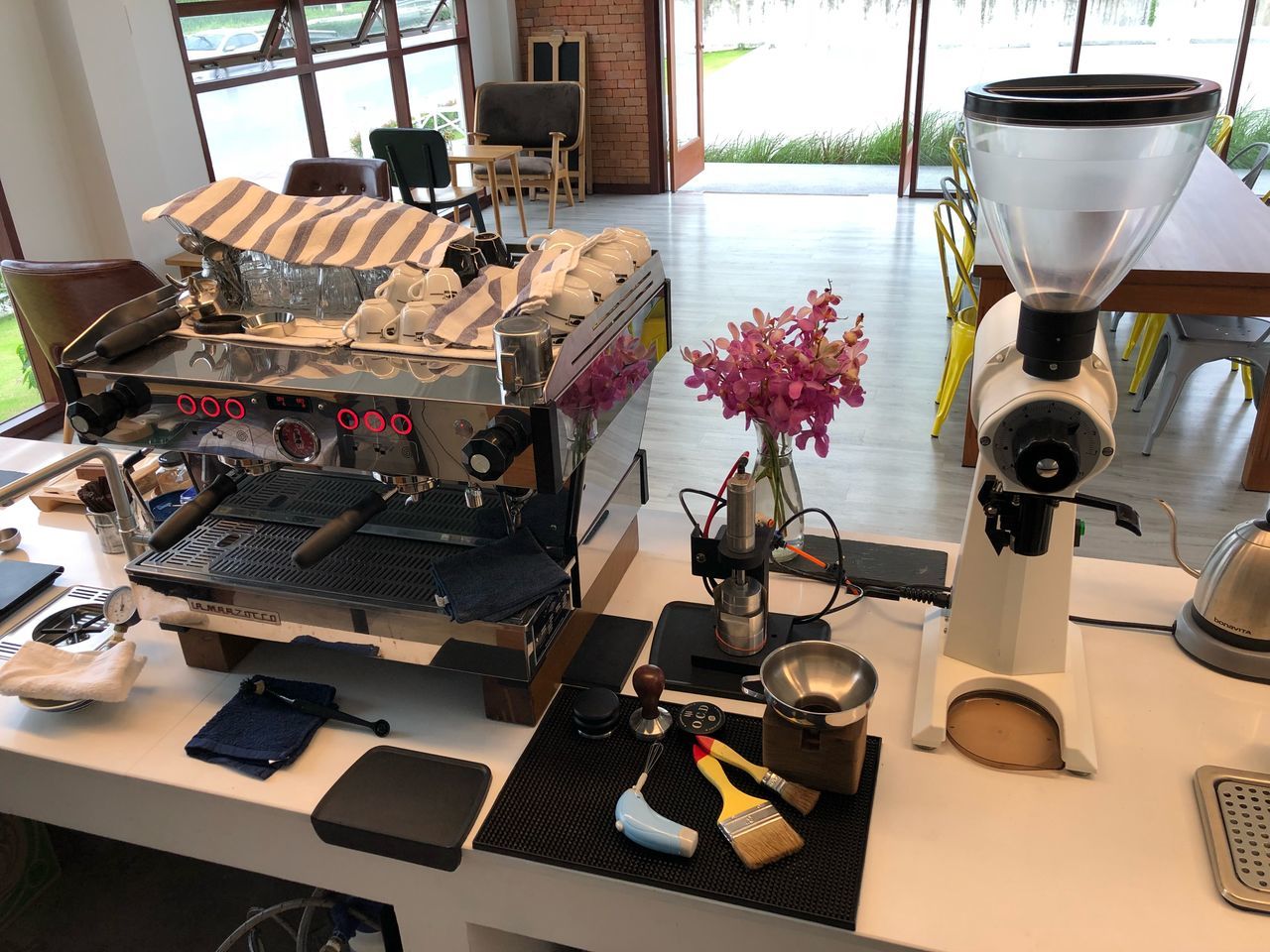 table, technology, indoors, no people, flower, flowering plant, machinery, close-up, still life, retro styled, plant, equipment, high angle view, coffee maker, day, camera - photographic equipment, nature, food and drink, appliance