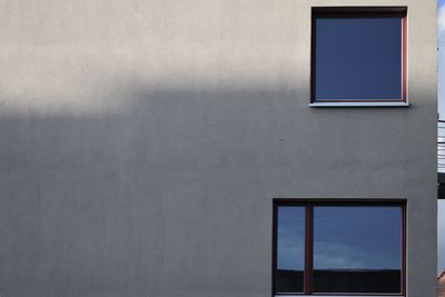 Low angle view of window on wall of building
